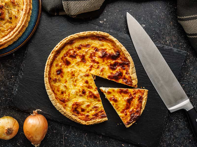 Traditional french Quiche lorraine on kitchen table