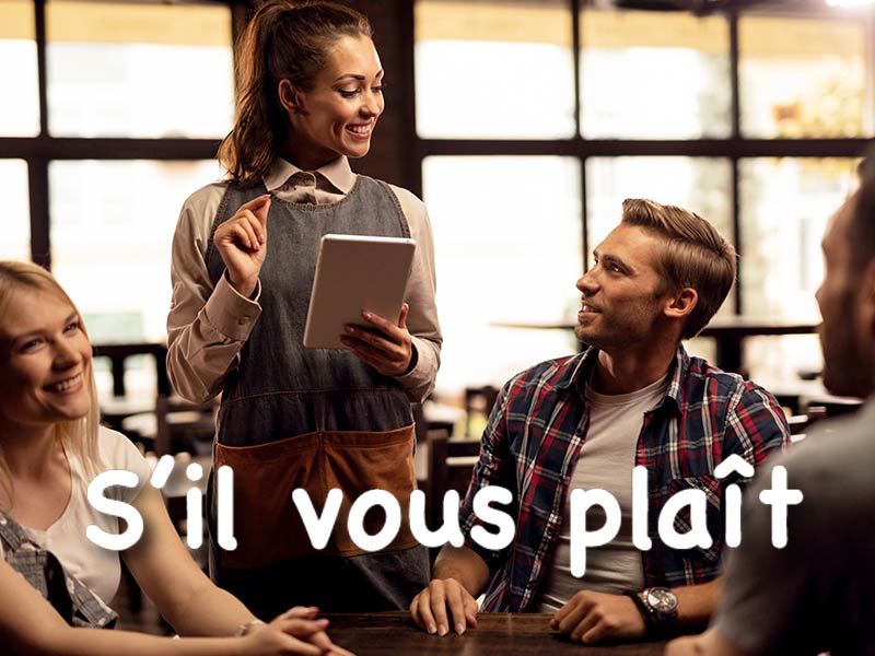 tourist saying S’il vous plaît in a french restaurant